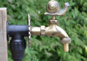 brass colour Snail ornamental garden tap