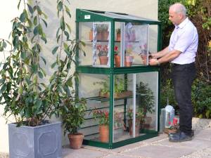 Mini greenhouse fitted to a wall