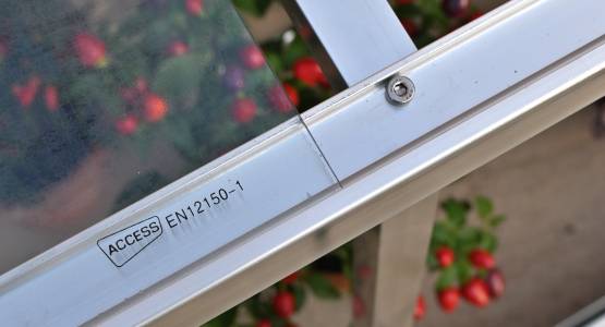 Toughened glass in wall frame
