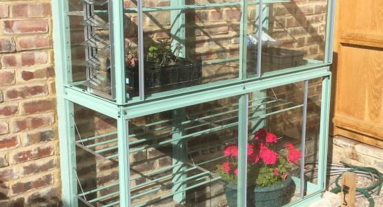 Fixing a Mini greenhouse to an uneven wall