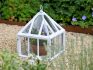 Cast iron garden cloche in a garden