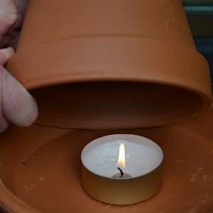 heating a greenhouse with a terracotta pot