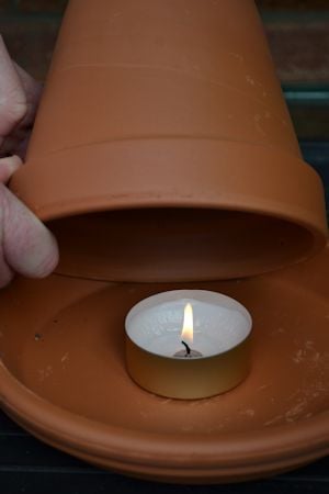 heating a greenhouse with a terracotta pot