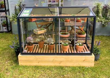 Powder coated Freestanding Harlow 5′ growhouse with 2 tier base and slats