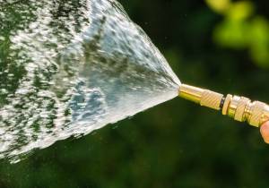 Brass hose spray nozzle in use
