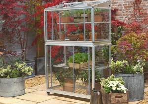 Portable greenhouse on wheels