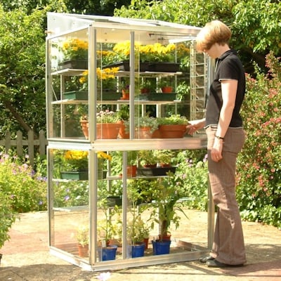 Woman standing by Access Classic growhouse